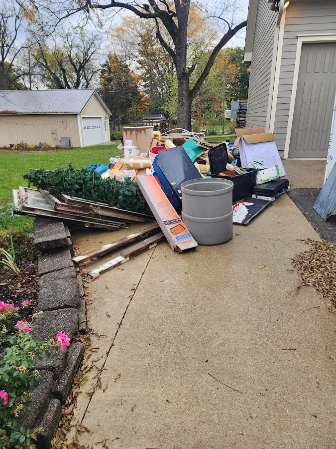 Dumpster being loaded with debris for Estate Cleanout Dumpster Rental in Cortez